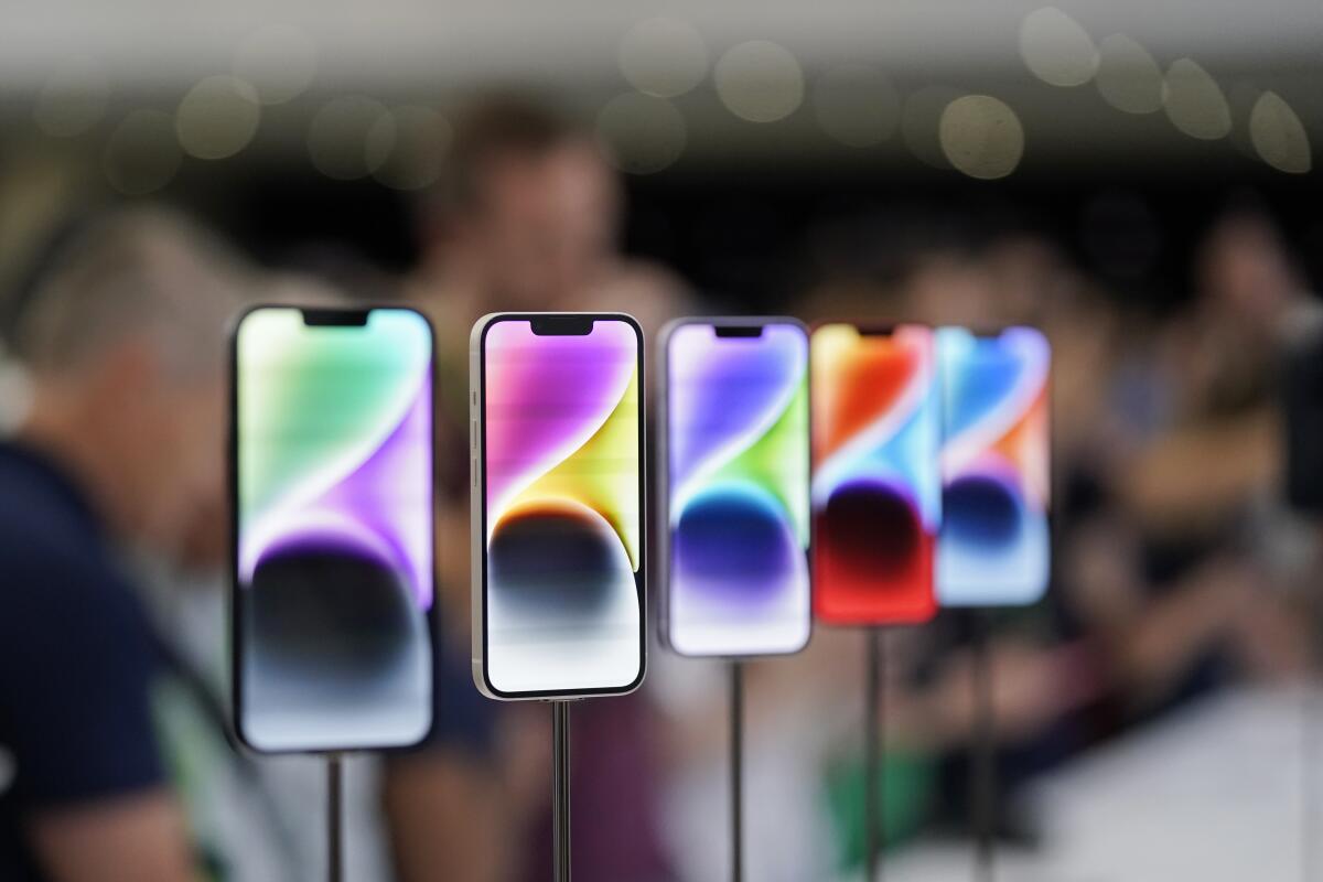 New iPhone 14 models on display at Apple's headquarters in Cupertino, Calif.