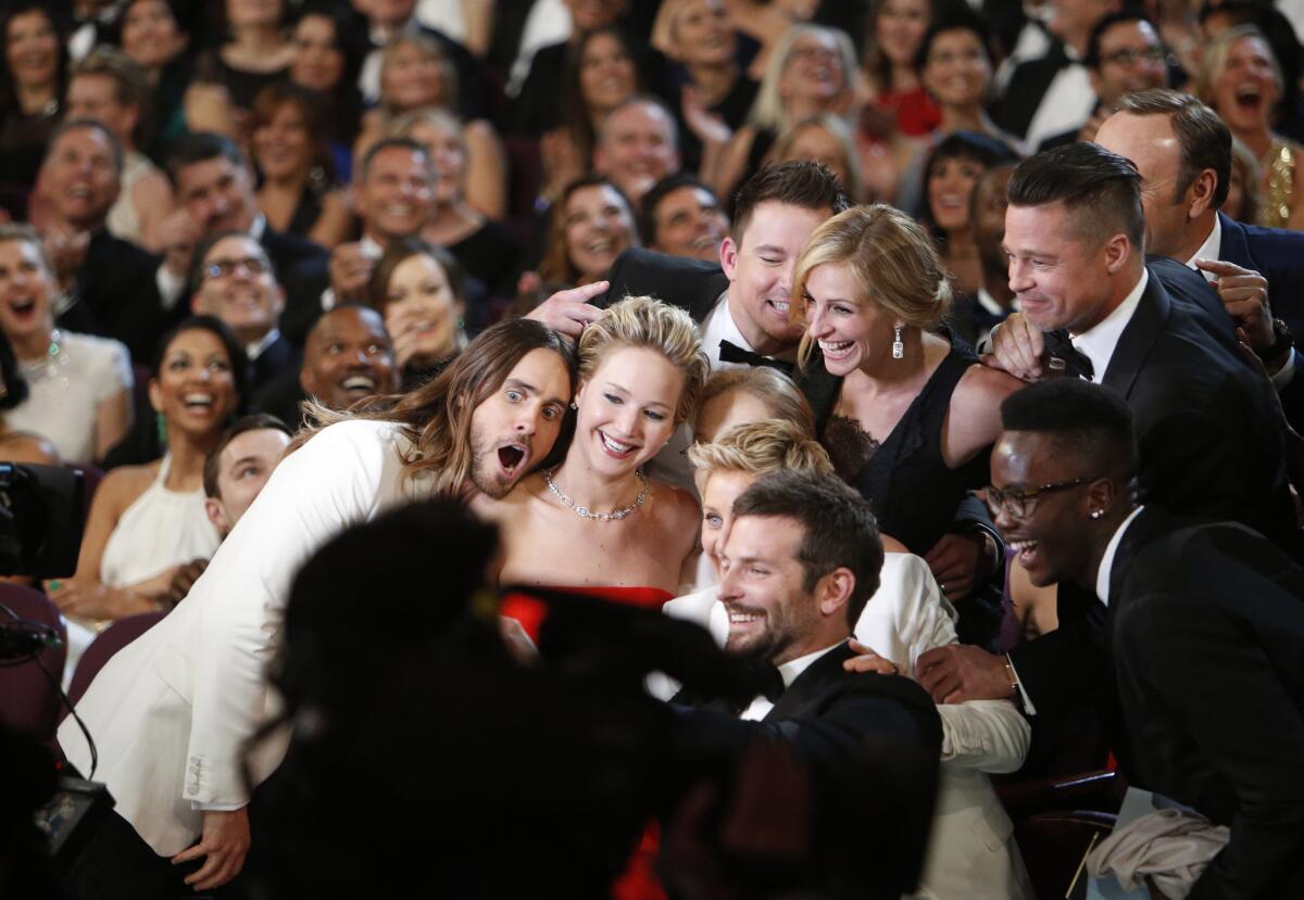 Ellen DeGeneres gathers members from the audience for a selfie, from backstage at the 86th Annual Academy Awards on Sunday at the Dolby Theatre at Hollywood & Highland Center in Hollywood.