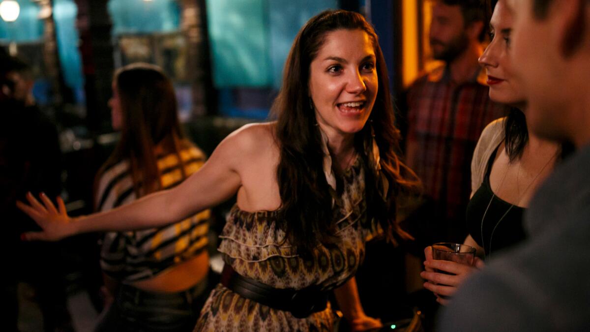 Laura Brunkala -- an actor, director, producer, singer, kickboxer and intermediate yogi -- socializes with the crowd after her band performed at The Other Door in Los Angeles.