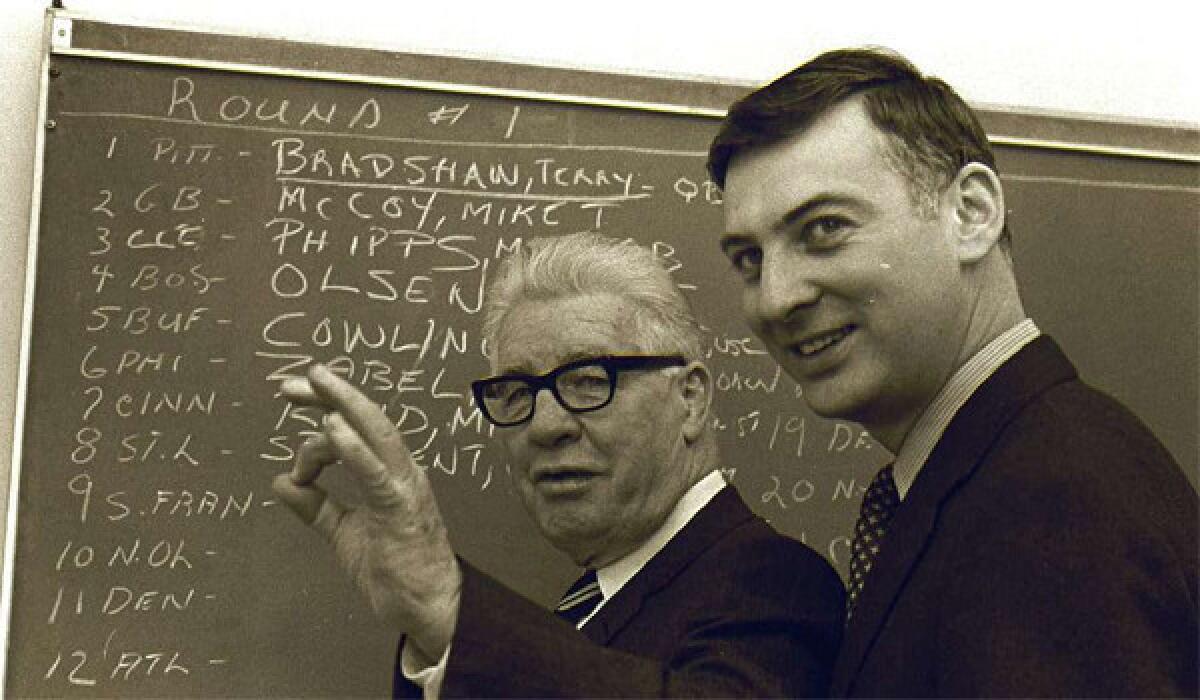 Pittsburgh Steelers owner Art Rooney, left, gestures as he discusses the signing of quarterback Terry Bradshaw, as his son, Dan, looks on in Pittsburgh, in this January 27, 1970 photo.