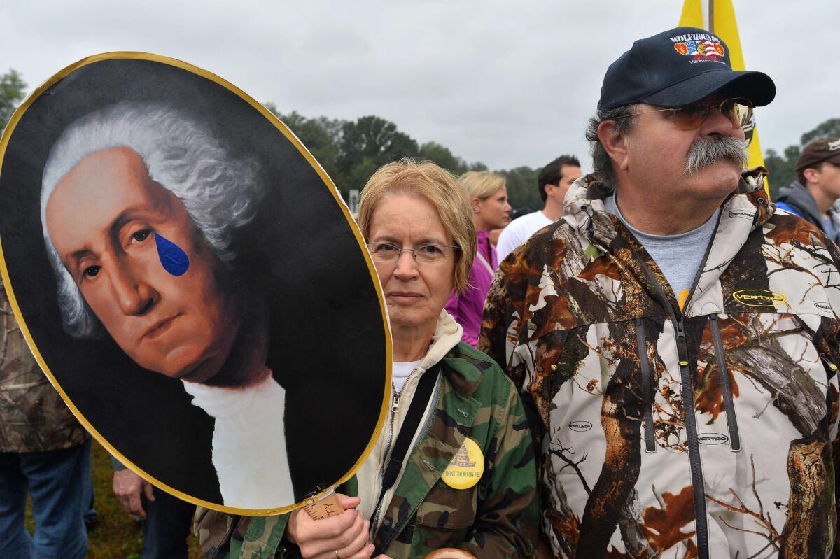 Protesters take part in a demonstration at the World War II memorial.