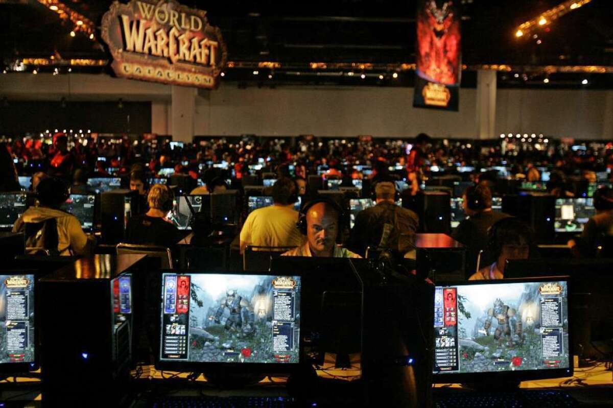 A couple described as obsessed with the World of Warcraft online game were sentenced to prison for neglecting two young girls in their care. Above, a World of Warcraft game area at a convention in Anaheim in 2009.