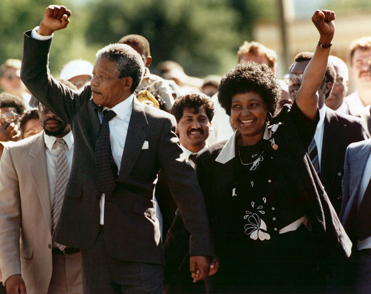 Nelson Mandela and his wife, Winnie Madikizela-Mandela, as Mandela walks free from the Victor Verster Prison in 1990
