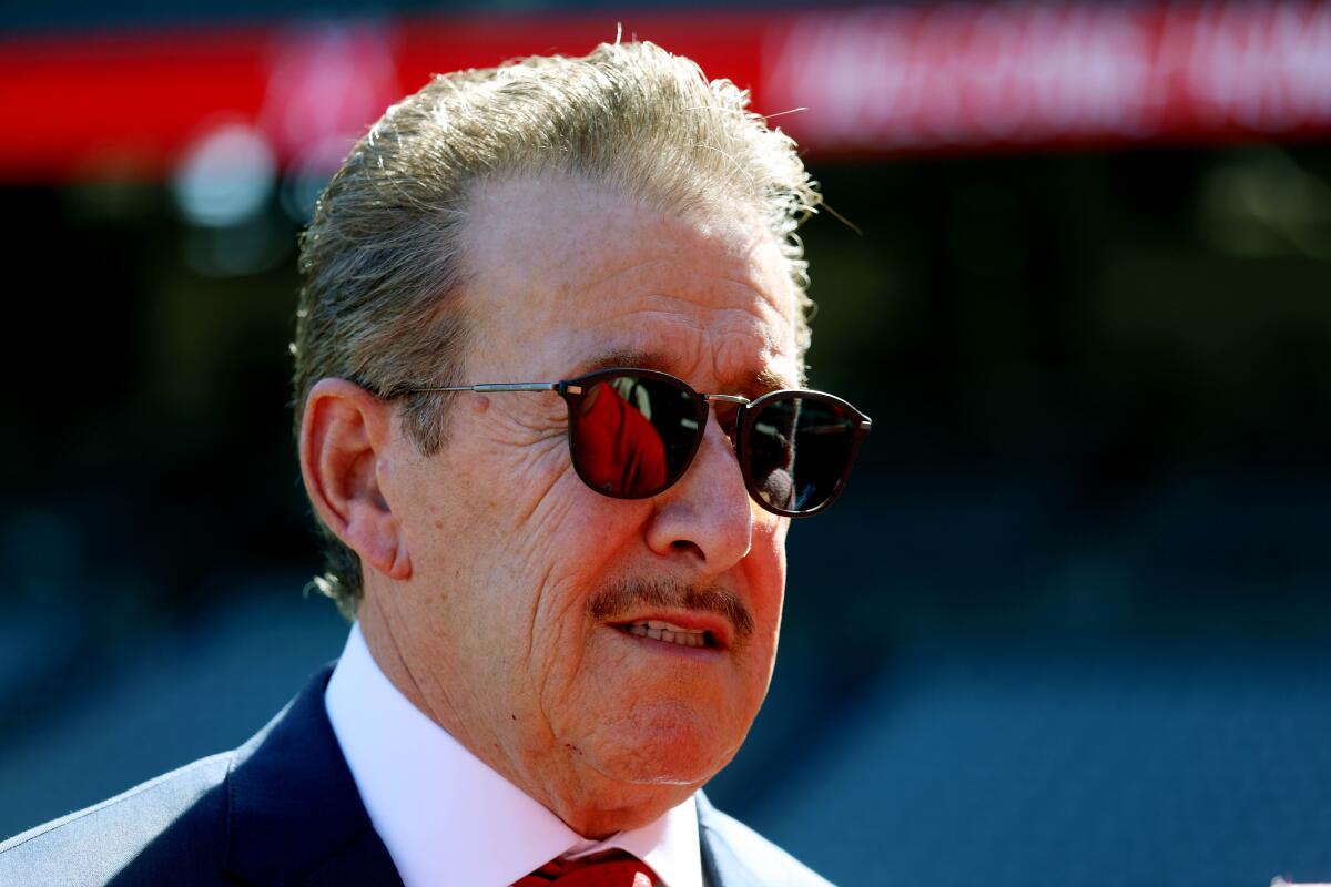 Angels owner Arte Moreno answers questions during a news conference Thursday at Angel Stadium.