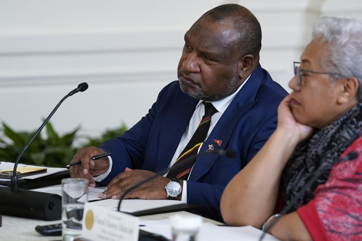 Papua New Guinean Prime Minister James Marape listens during a meeting at the White House.
