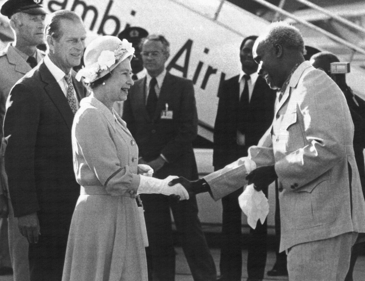 Zambian President Kenneth Kaunda greeting Britain's Queen Elizabeth II