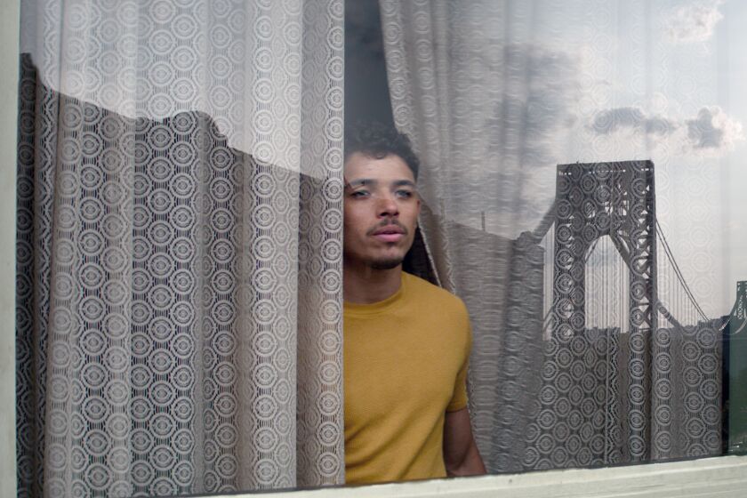 A man gazing out a window