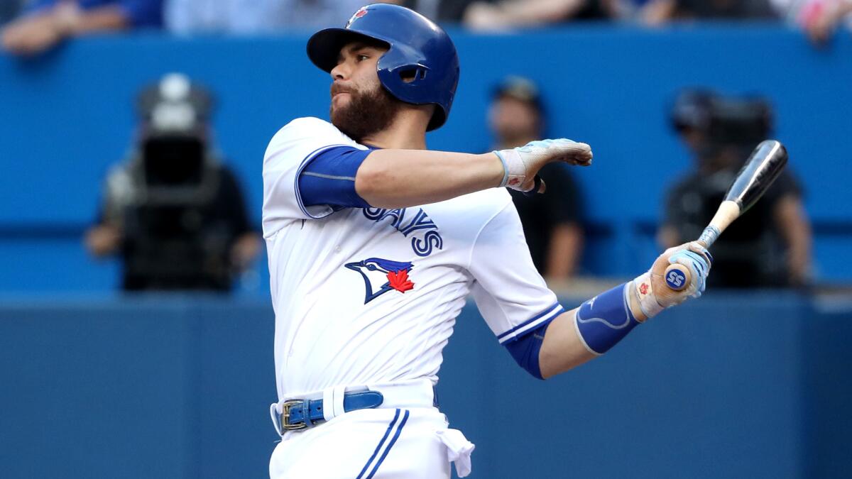 Blue Jays catcher Russell Martin connects for a double against the Tigers during a game July 7.