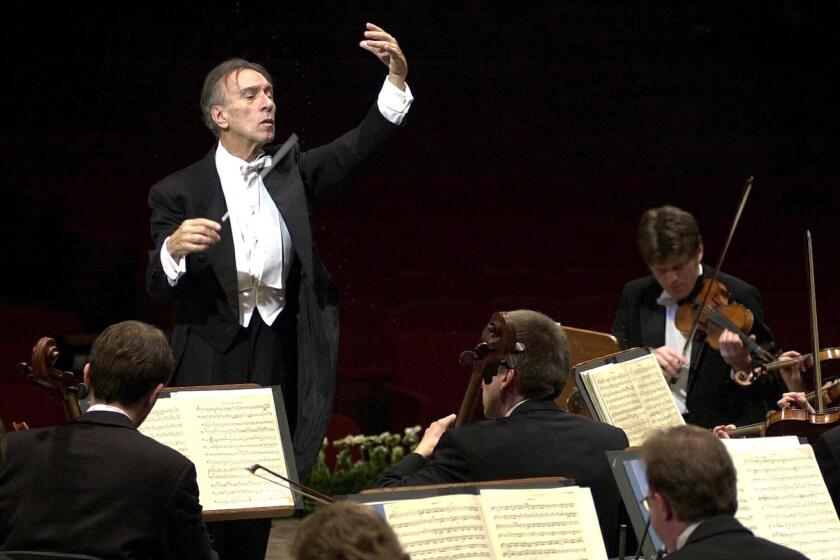 Italian conductor Claudio Abbado, shown in 2001 during rehearsals with the Berlin Philharmonic Orchestra has died at the age of 80 in Bologna.