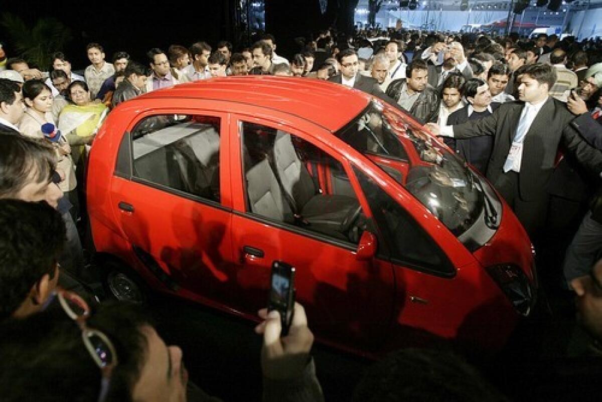 The Nano is unveiled in New Delhi to much excitement. The four-seater is priced around $2,500 -- about half the price of the world's cheapest car.