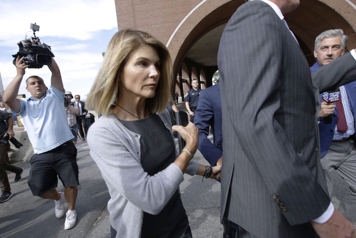 Lori Loughlin leaves federal court in Boston last year after a hearing in the nationwide college admissions scandal.
