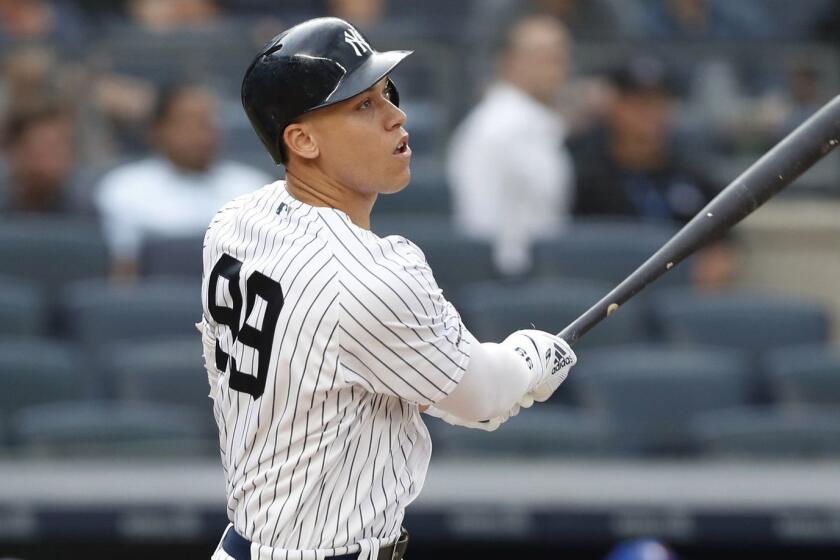 New York Yankees' Aaron Judge watches his solo home run during the first inning of the team's baseball game against the Toronto Blue Jays, Tuesday, June 25, 2019, in New York. It was Judge's first home run since returning from a stint on the injured list. (AP Photo/Kathy Willens)