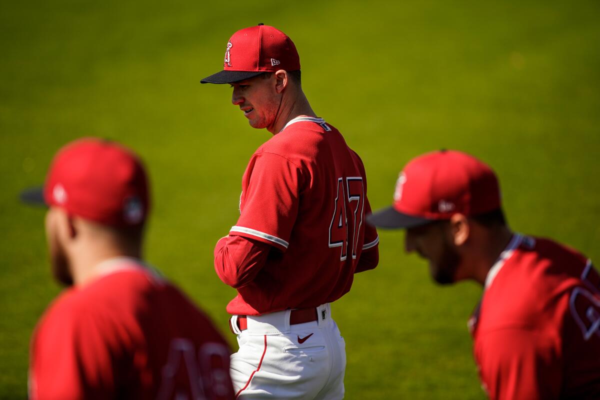 Angels Griffin Canning (47) warms up with teammates during spring training at Tempe Diablo Stadium on Feb. 18 in Tempe, Ariz.