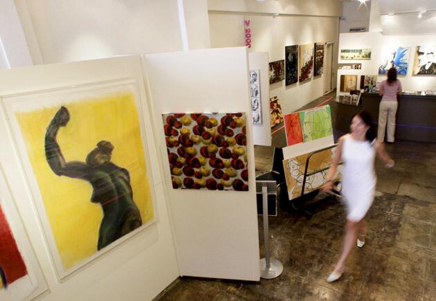 Artspace Warehouse, which opened about a year ago in Los Angeles, specializes in affordable art. At left is art work by local artist Judy Zimbert.