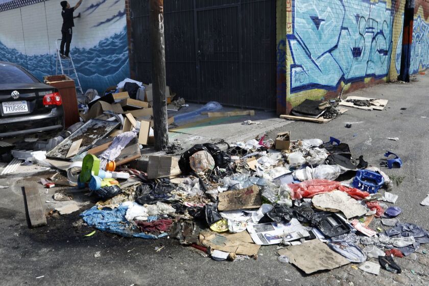 LOS ANGELES, CA-OCTOBER 11, 2018: A pile of trash sits uncollected on Santee St. in between 18th St. and Washington Blvd in the fashion district of Los Angeles. An outbreak of typhus has been linked to overcrowding/homelessness in downtown Los Angeles. Businesses in the fashion district are complaining that the outbreak will spread because the city hasn't picked up trash their. (Mel Melcon/Los Angeles Times)