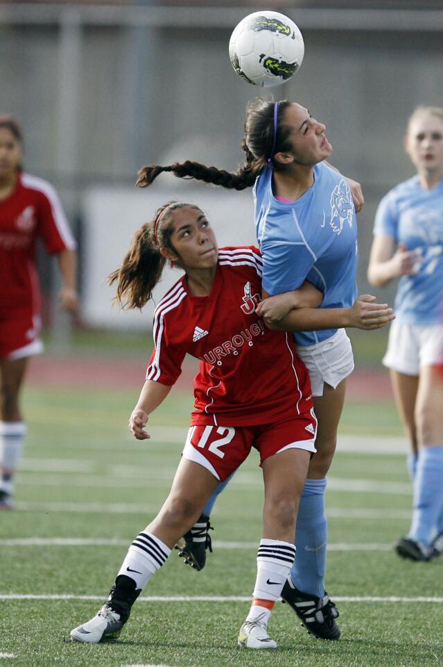 Burroughs' Brianna Castillo, left, and CV's Katie Callister fight for the ball during a game at John Burroughs High School in Burbank on Friday, February 1, 2013.