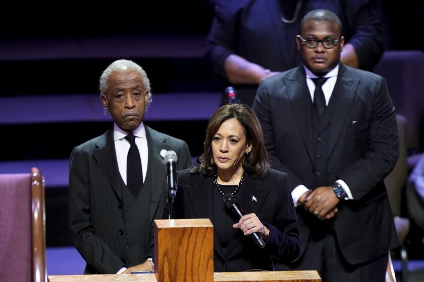 Vice President Kamala Harris speaks during the funeral service for Tyre Nichols at Mississippi Boulevard Christian Church in Memphis, Tenn., on Wednesday, Feb. 1, 2023. Standing are Rev. Al Sharpton and Rev. Dr. J. Lawrence Turner. Nichols died following a brutal beating by Memphis police after a traffic stop. (Andrew Nelles/The Tennessean via AP, Pool)