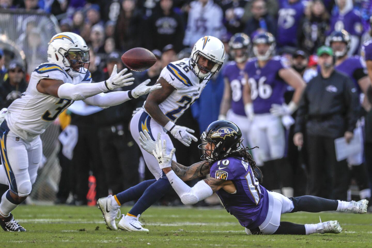 Chargers safety Adrian Phillips intercepts a pass thrown by Lamar Jackson during the first quarter.