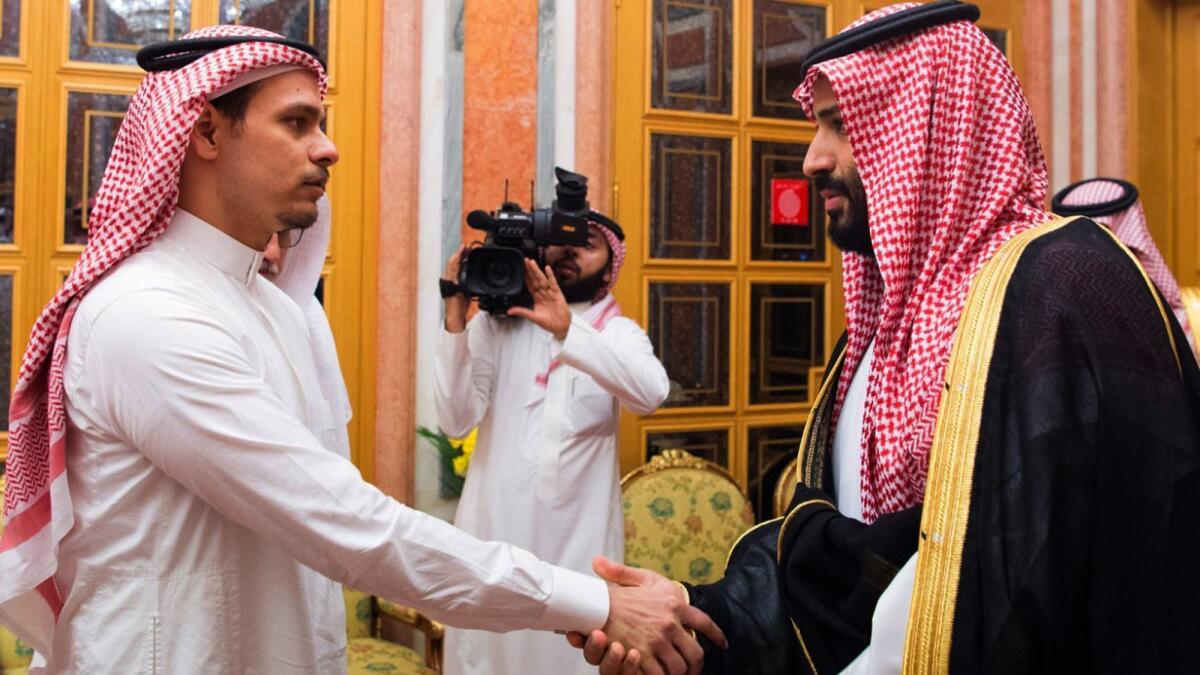 Saudi Crown Prince Mohammed bin Salman shakes hands with Salah Khashoggi, a son of Jamal Khashoggi, in Riyadh on Oct. 23.