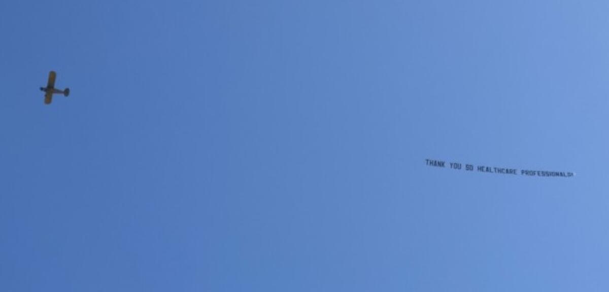 A plane towing a banner flies over Scripps Green Hospital in La Jolla on April 24 with a message of thanks for health care workers.