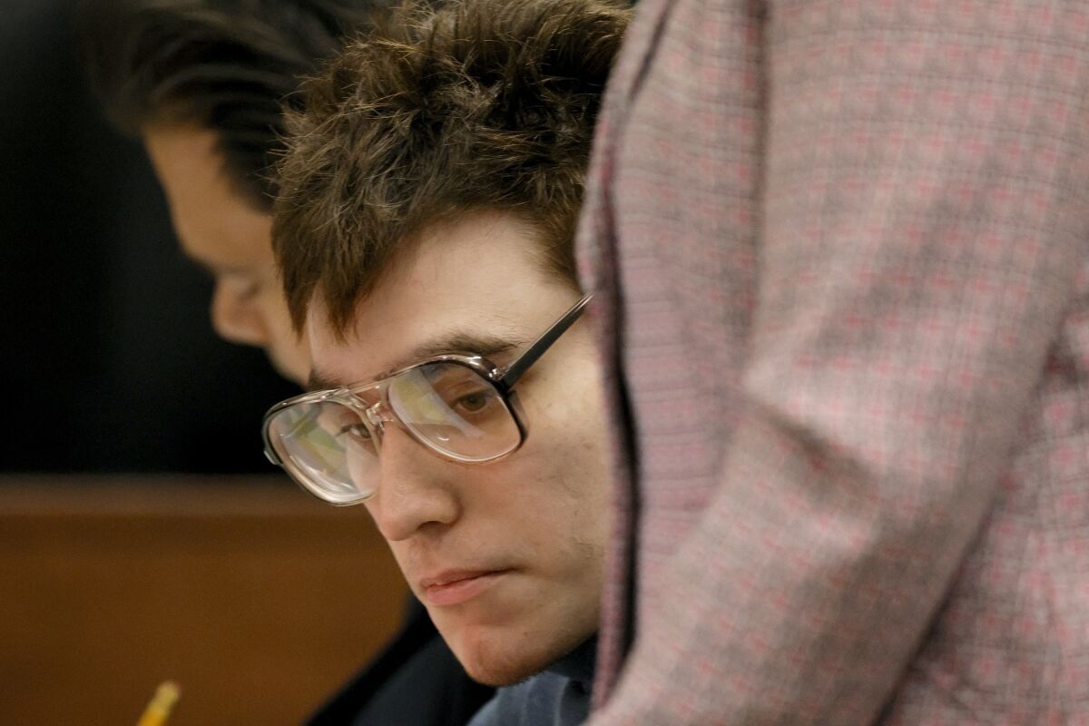 FILE -Marjory Stoneman Douglas High School shooter Nikolas Cruz is shown at the defense table during jury pre-selection in the penalty phase of his trial at the Broward County Courthouse in Fort Lauderdale, Fla. on Tuesday, April 12, 2022. Confusion reigned as jury selection in the death penalty trial of Florida school shooter Nikolas Cruz concluded its second week with no immediate end in sight.(Amy Beth Bennett/South Florida Sun Sentinel via AP, File, Pool, File)