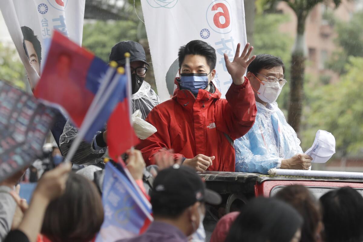 Taiwan's opposition Kuomintang KMT party Taipei city mayoral candidate Wayne Chiang waves to supporters in Taipei, Taiwan