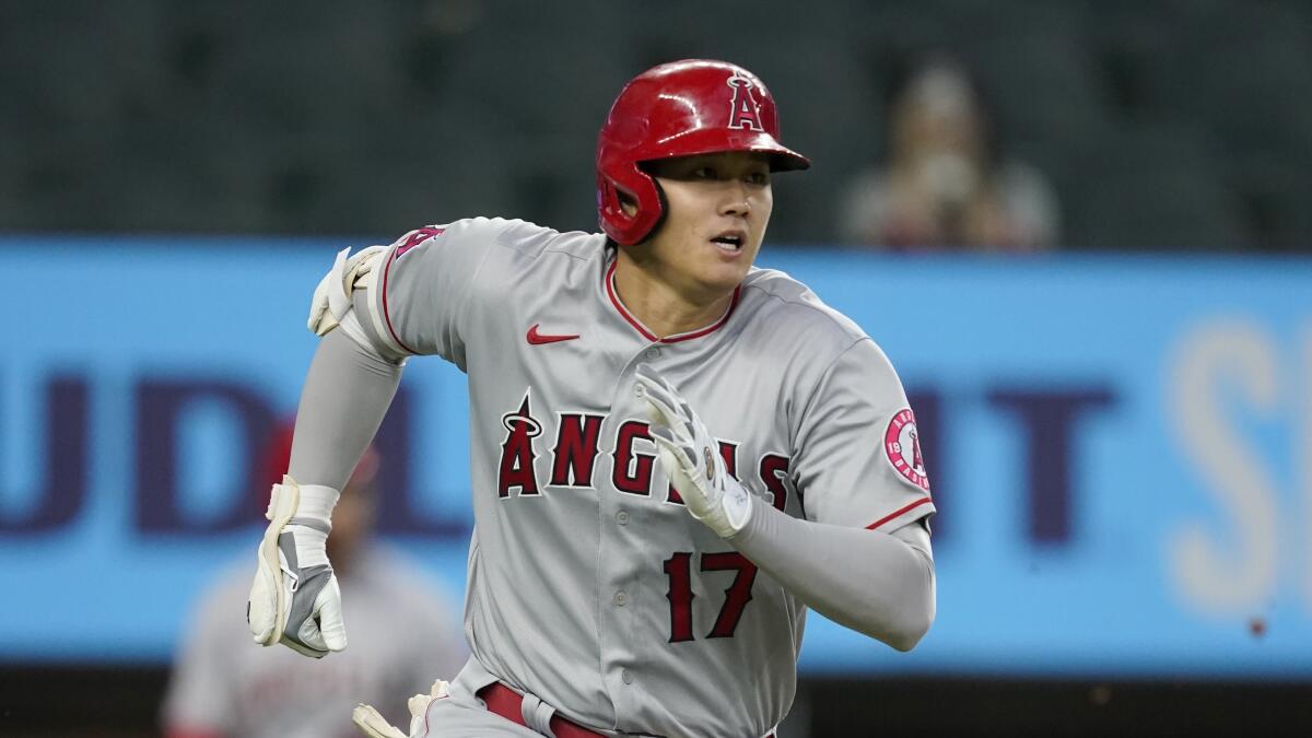 Angels star Shohei Ohtani sprints out of the batters box after a hit against the Texas Rangers on Sept. 30.
