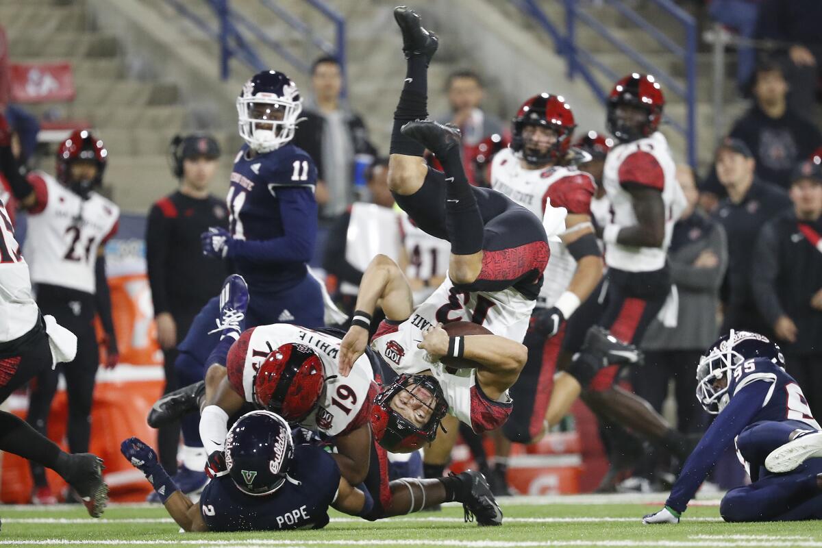 San Diego State kicker Jack Browning goes upside down at Fresno State as he is tackled on 33-yard run after a fake punt.