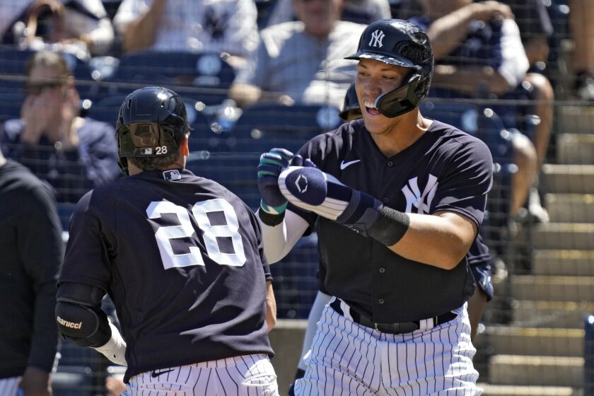 New York Yankees' Josh Donaldson (28) celebrates with Aaron Judge after Donaldson hit a three-run home run off Detroit Tigers relief pitcher Will Vest during the sixth inning of a spring training baseball game Tuesday, March 21, 2023, in Tampa, Fla. (AP Photo/Chris O'Meara)