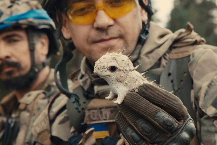 A smiling soldier holds a delicate porcelain creature.