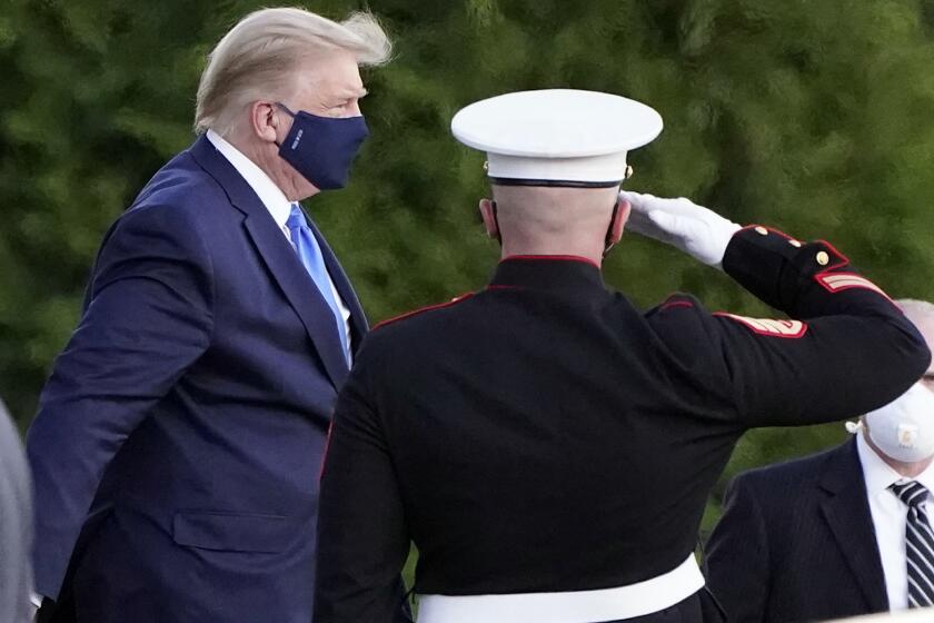 President Trump arrives at Walter Reed National Military Medical Center  in Bethesda, Md., on Friday.