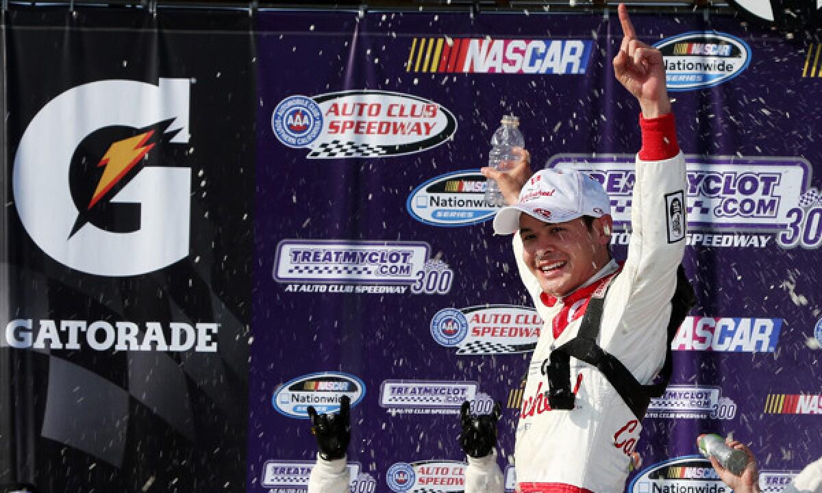 Kyle Larson celebrates after winning Saturday's NASCAR Nationwide Series race at Auto Club Speedway in Fontana.