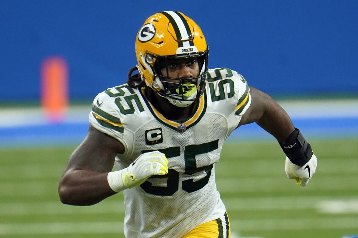 FILE- In this Dec. 13, 2020, file photo, Green Bay Packers outside linebacker Za'Darius Smith (55) plays against the Detroit Lions during the first half of an NFL football game in Detroit. Smith is practicing again and could return for the playoffs after missing nearly the entire regular season. (AP Photo/Paul Sancya, File)