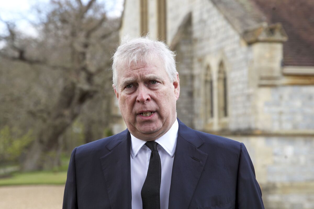 FILE - Britain's Prince Andrew speaks during a television interview at the Royal Chapel of All Saints at Royal Lodge, Windsor, April 11, 2021. Lawyers for Prince Andrew and Virginia Giuffre, who accused him of sexually abusing her when she was 17, formally asked a judge Tuesday to dismiss her lawsuit. (Steve Parsons/Pool Photo via AP, File)