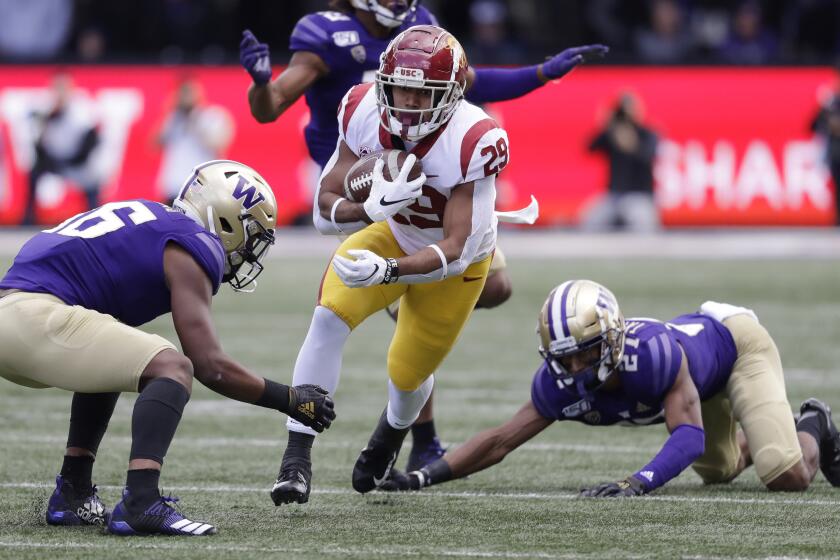 Southern Cal's Vavae Malepeai (29) carries against Washington in the first half of an NCAA college football game Saturday, Sept. 28, 2019, in Seattle. (AP Photo/Elaine Thompson)