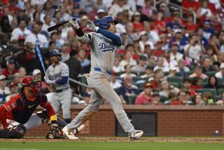 Dodgers star Shohei Ohtani follows through on a home run against the St. Louis Cardinals on Saturday.