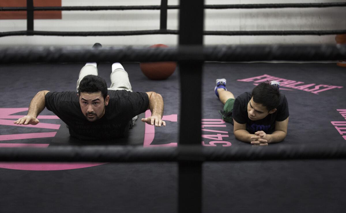 Gonzalez, left, works out with Somodio.