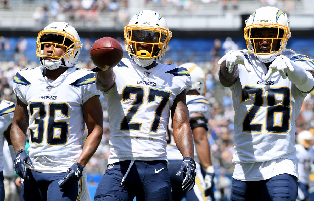 Chargers Roderic Teamer, from left, Jaylen Watkins and Brandon Facyson