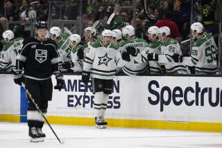Dallas Stars left wing Jason Robertson celebrates with his teammates after scoring against the Kings.