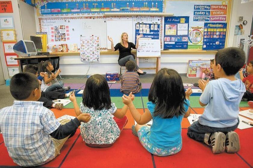 At Central Elementary School in San Diego's City Heights, kindergarten teacher Michelle Icenhower worked on a word lesson with her class of 16 students. The school participates in a project involving unusually small class sizes.