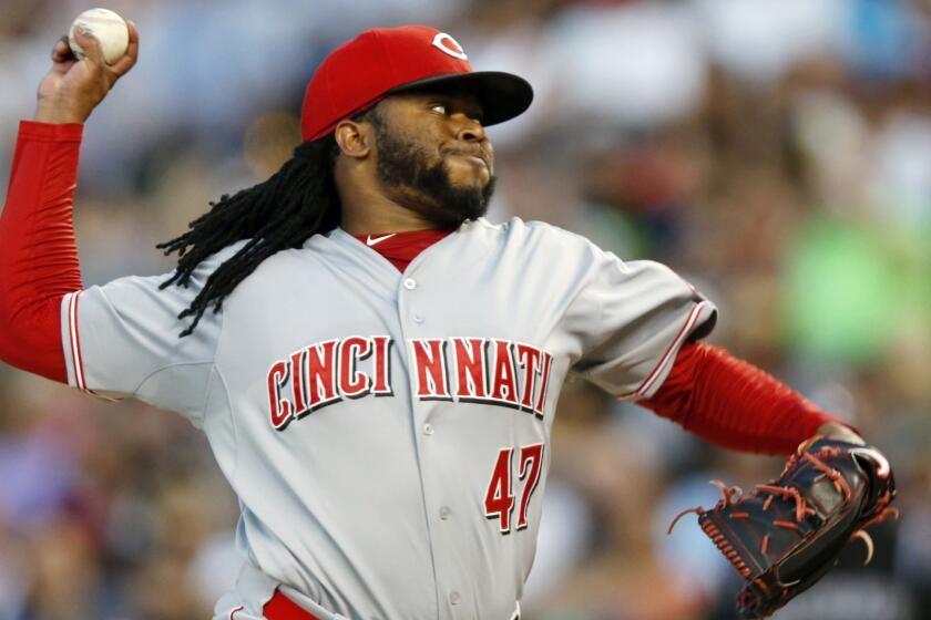 Cincinnati Reds starter Johnny Cueto delivers a pitch during a game against the Colorado Rockies on Saturday.