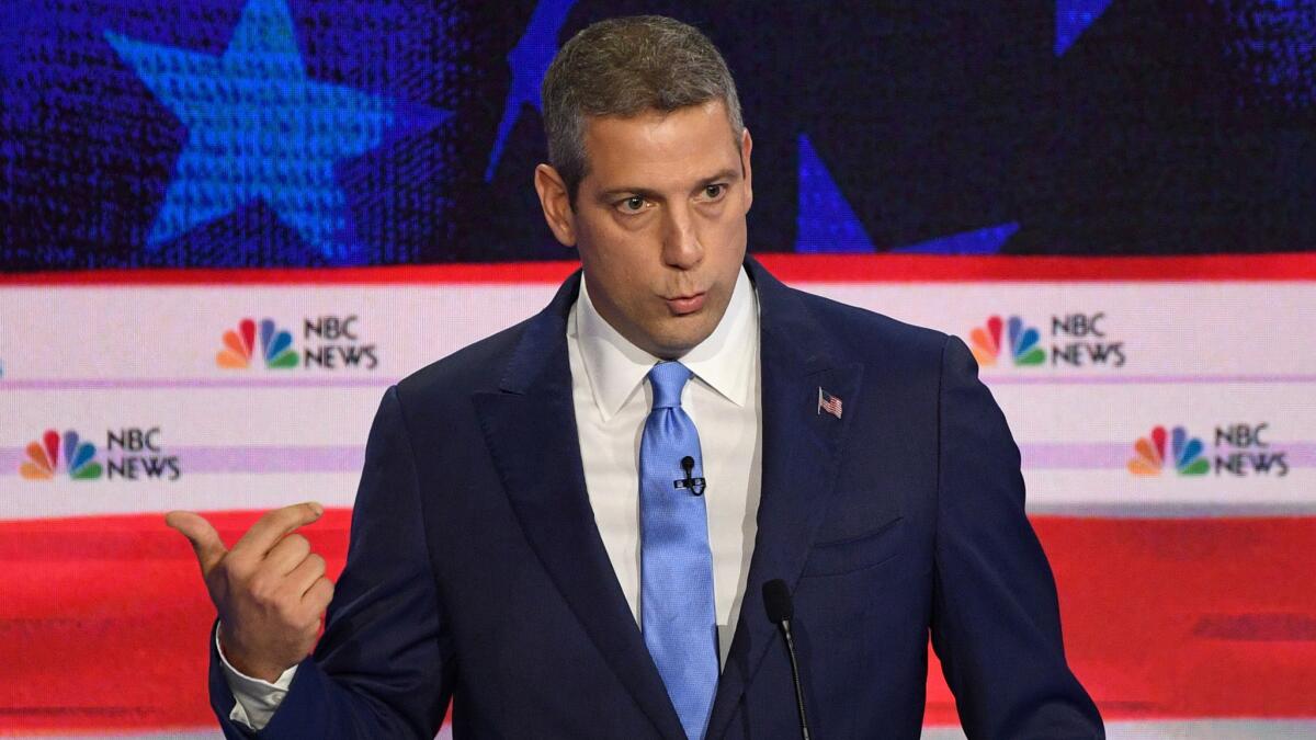 Ohio Rep. Tim Ryan wore a navy blue suit, light blue necktie and an American flag label pin — similar to former Maryland Rep. John Delaney. (Jim Watson / AFP/Getty Images)