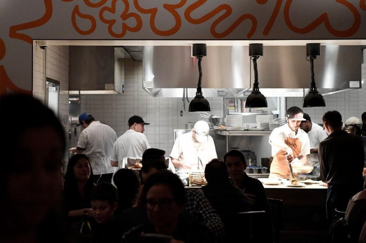 The kitchen at Hippo opens into the airy dining room.