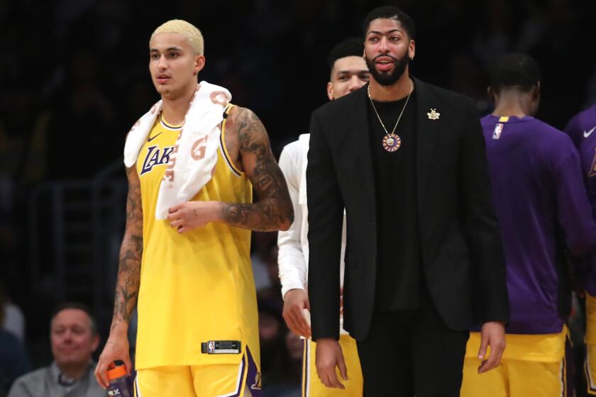 LOS ANGELES, CALIFORNIA - JANUARY 13: Kyle Kuzma #0 and Anthony Davis #3 of the Los Angeles Lakers look on during the second half of a game against the Cleveland Cavaliers at Staples Center on January 13, 2020 in Los Angeles, California. NOTE TO USER: User expressly acknowledges and agrees that, by downloading and/or using this photograph, user is consenting to the terms and conditions of the Getty Images License Agreement. (Photo by Sean M. Haffey/Getty Images)