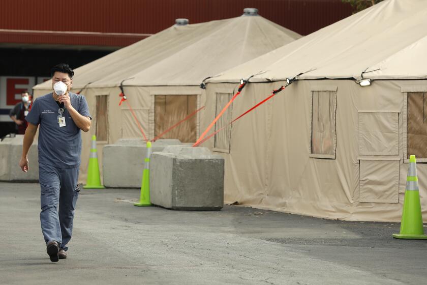SANTA ANA-CA-DECEMBER 11, 2020: Triage tents are set up outside of the Emergency Room at Orange County Global Medical Center in Santa Ana on Friday, December 11, 2020. (Christina House / Los Angeles Times)
