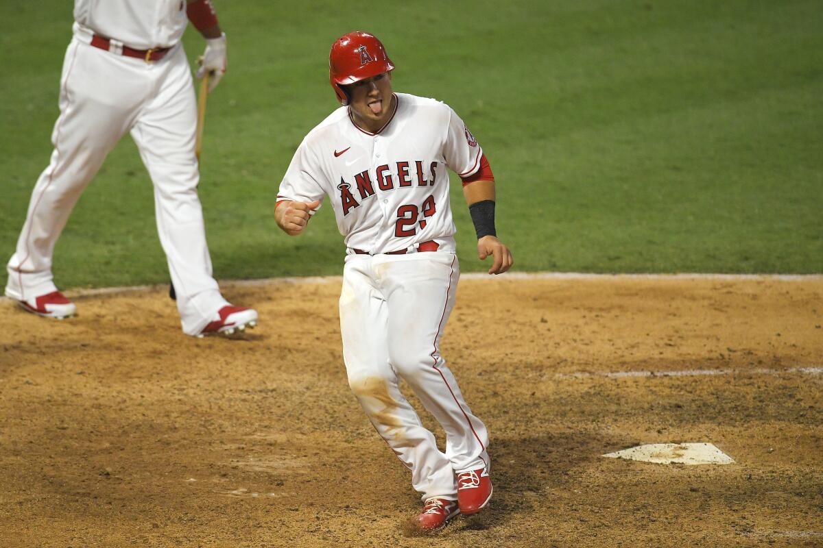 The Angels' Matt Thaiss reacts after scoring on a sacrifice fly hit by Michael Hermosillo to win the game Aug. 1, 2020.