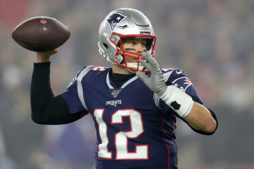 FOXBOROUGH, MASSACHUSETTS - JANUARY 04: Tom Brady #12 of the New England Patriots looks to pass against the Tennessee Titans in the first quarter of the AFC Wild Card Playoff game at Gillette Stadium on January 04, 2020 in Foxborough, Massachusetts. (Photo by Maddie Meyer/Getty Images)