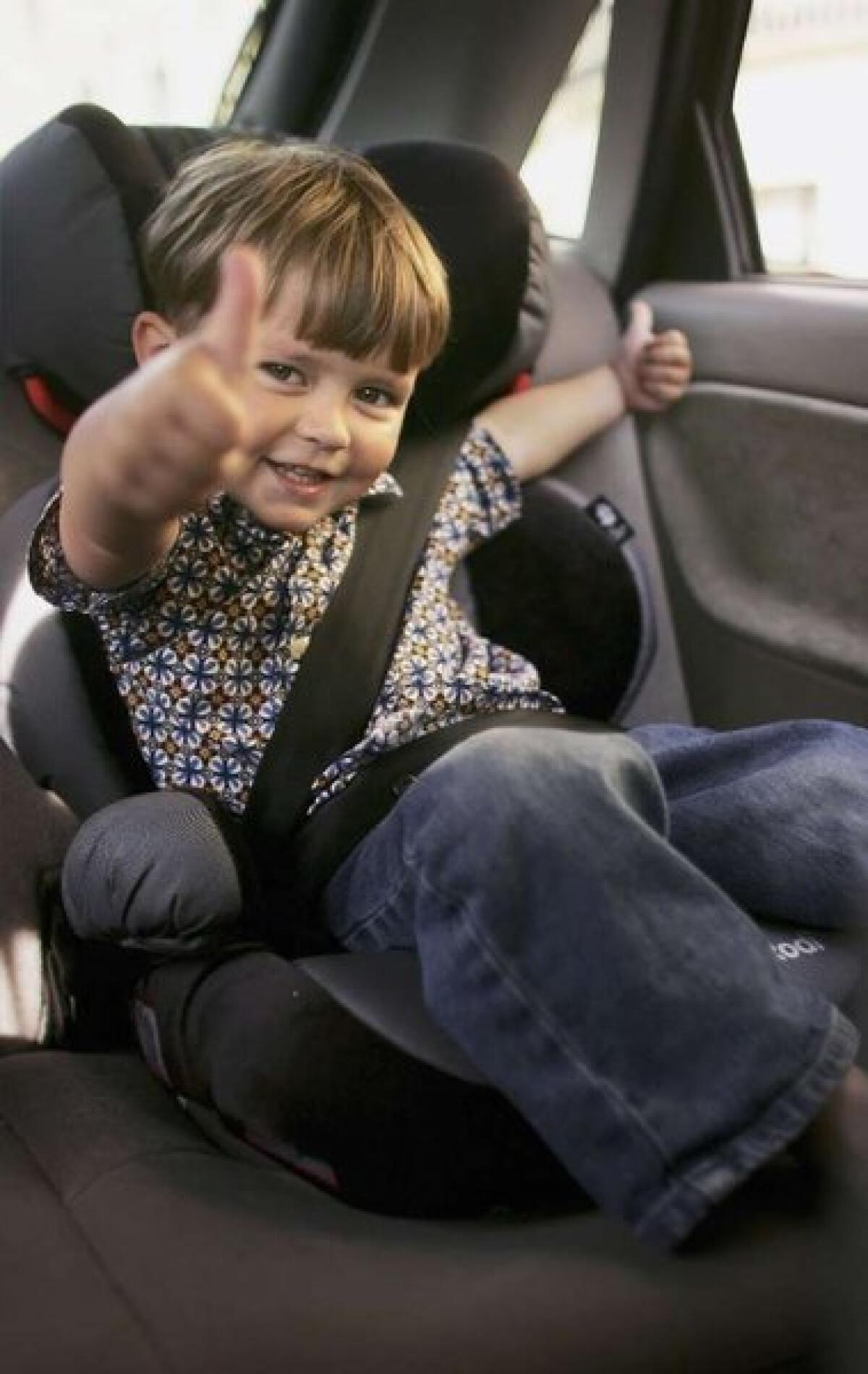 Booster seats, like this one, help kids use a car's seat belts safely.
