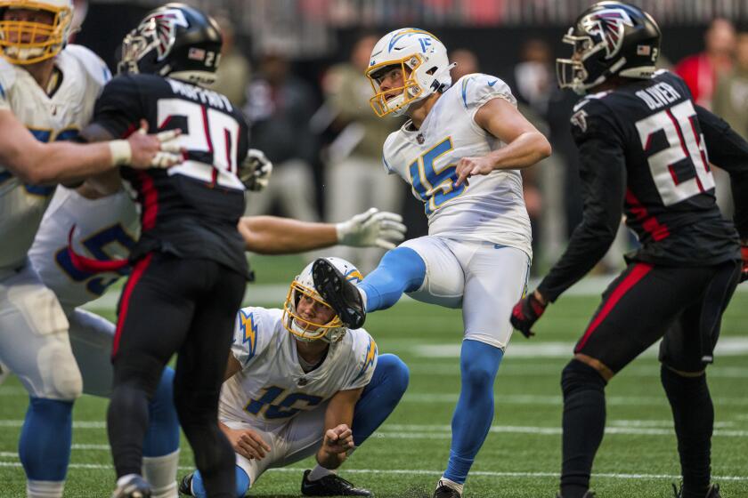 Los Angeles Chargers place kicker Cameron Dicker (15) kicks the game winning field goal during the second half of an NFL football game against the Atlanta Falcons, Sunday, Nov. 6, 2022, in Atlanta. The Los Angeles Chargers won 20-17. (AP Photo/Danny Karnik)
