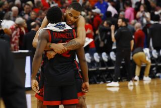 Louisville, KY - March 24: San Diego State's Keshad Johnson and Darrion Trammell celebrate during a win against Alabama in a Sweet 16 game in the NCAA Tournament on Friday, March 24, 2023 in in Louisville, KY. (K.C. Alfred / The San Diego Union-Tribune)